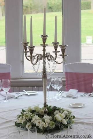 Elegant five-arm candelebra with flower & foliage ring - by Floral Accents.