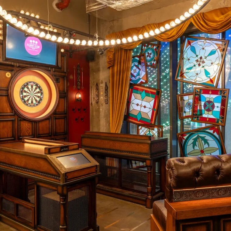 dart board in a heavily themed bar environment 