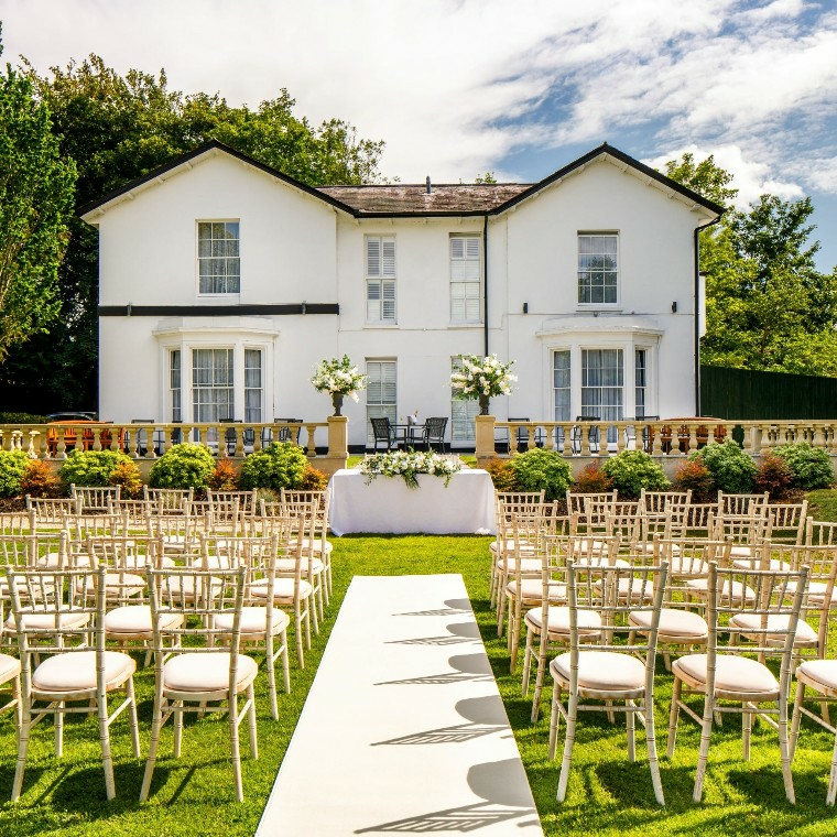 Outdoor wedding ceremony at Hawkwell House in Oxfordshire