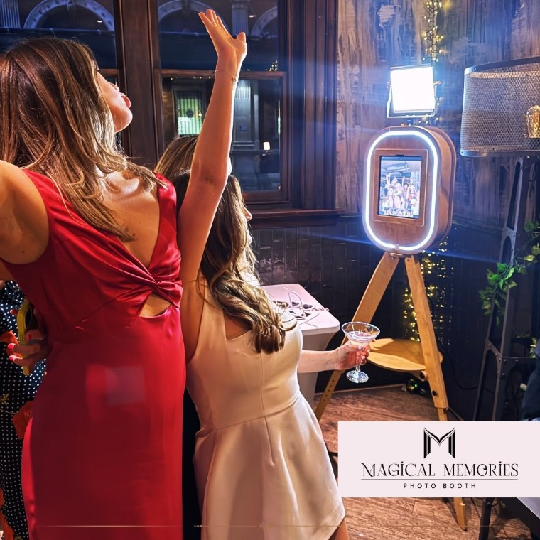 Bride and bridesmaid posing fro Magical Memories photobooths
