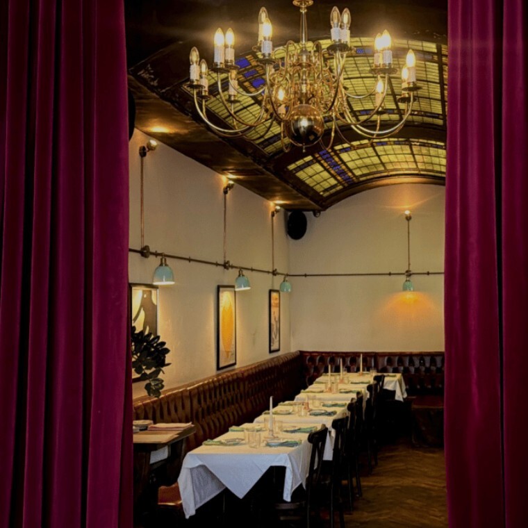Candlelit Banquet Table With White Tablecloths at Elephant, Hackney