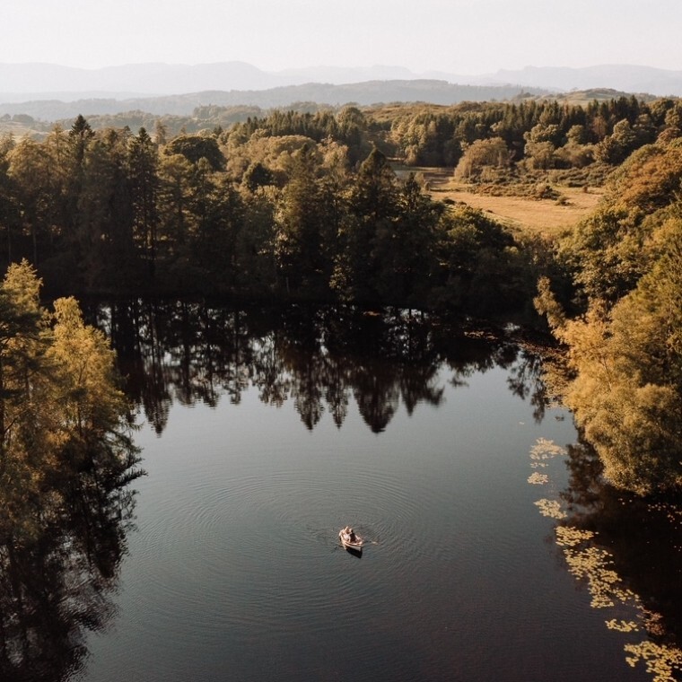 Gilpin Lake House couple rowing on lake