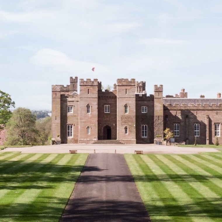 Scone Palace driveway with Palace exterior at the end of the road