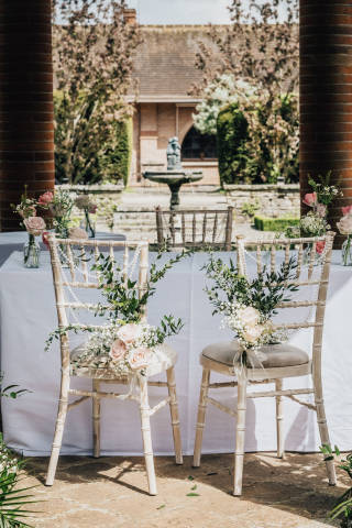 Outside ceremony setting for wedding couple at Milton Hill House