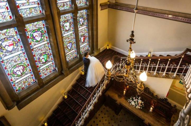 Hall staircase with stainglass window