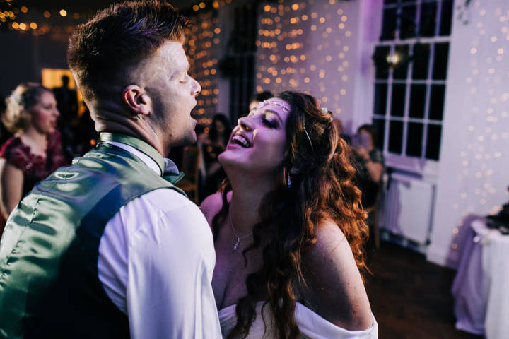 Couple Dancing Under Purple Light at Tawstock Court Wedding Venue