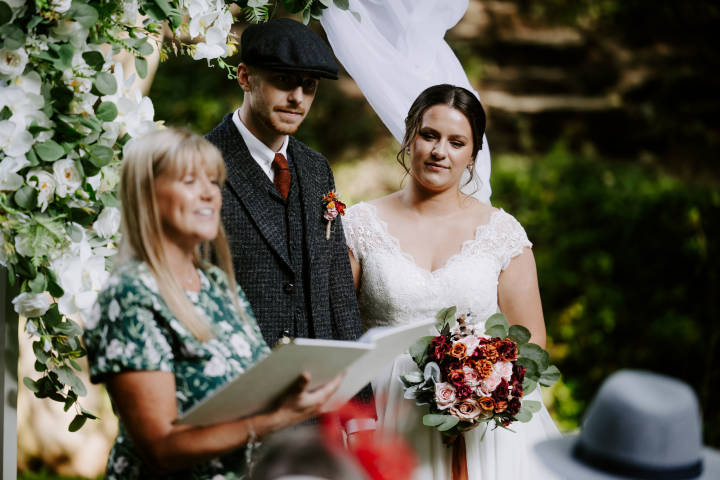 Celebrant Lisa with bride and groom in the Rocky Valley