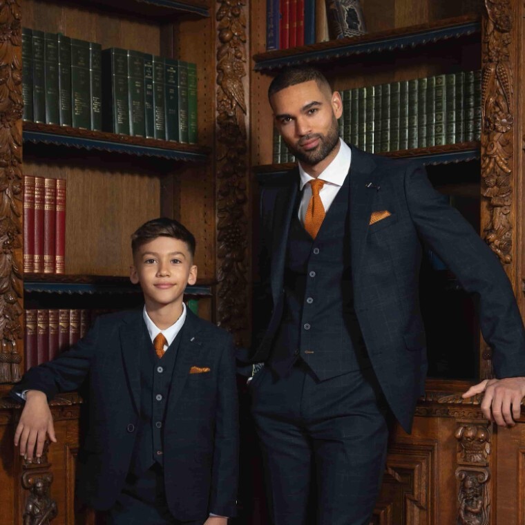 Man and boy wearing house of cavani suit