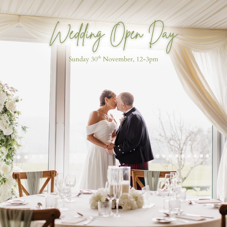 Couple sharing a kiss on their wedding day in the Orchard Marquee at Black Horse Beamish