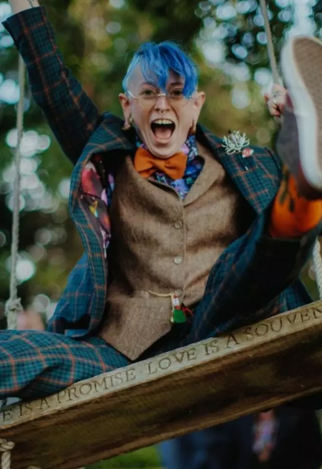 Women in brown and blue suit on a swing