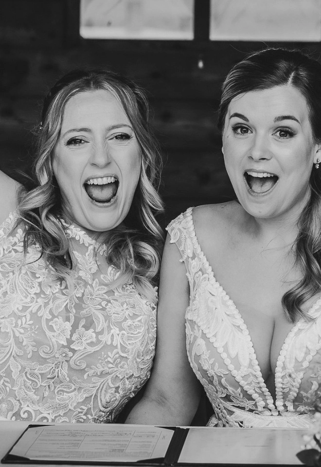 2 brides signing their marriage certificate, married at manor hill house bromsgrove