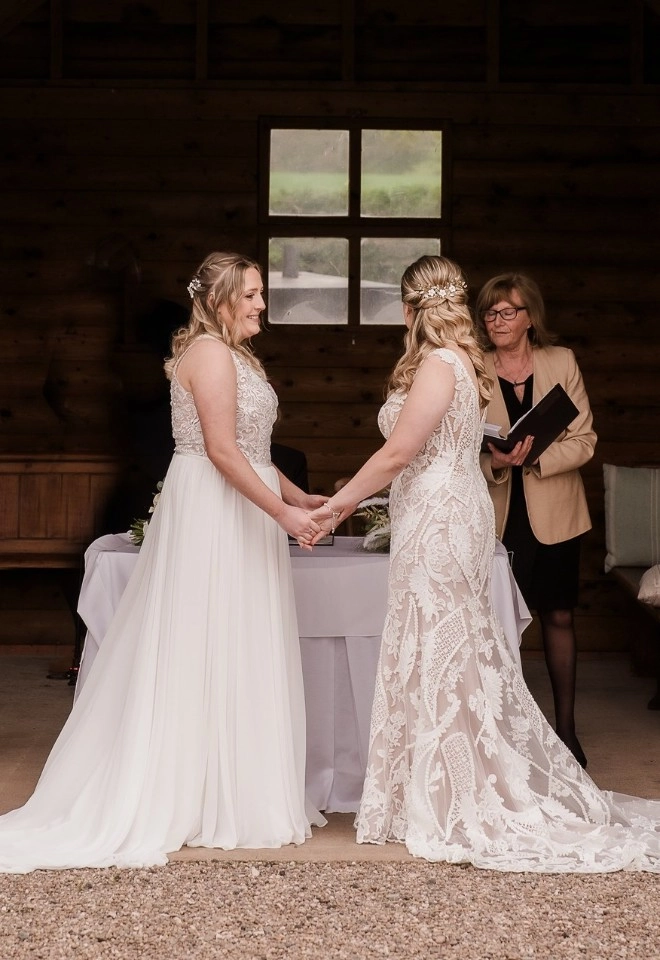 wedding ceremony at manor hill house wedding two brides saying their wedding vows