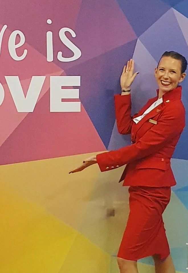 Gabrielle for Celebrancy by Gabrielle stood in front of a Love is Love sign